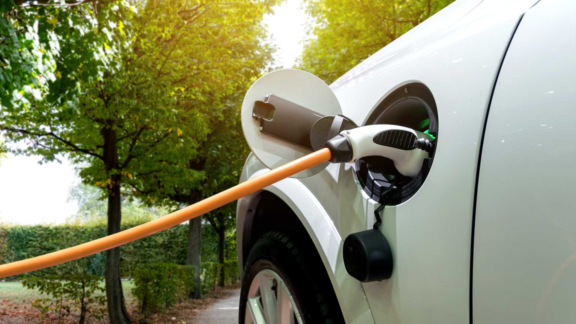 Charging an electric car with the power cable supply plugged in